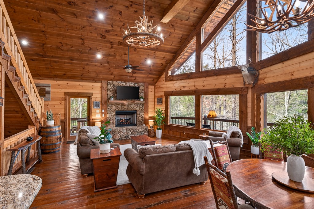 40 Adelaide Trail Blue Ridge, GA 30513 - Photo 5 of 32 a living room with fireplace furniture and a large window