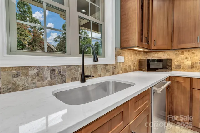 a view kitchen with a sink and cabinets
