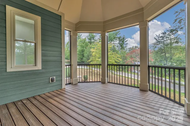 a view of a balcony with wooden floor