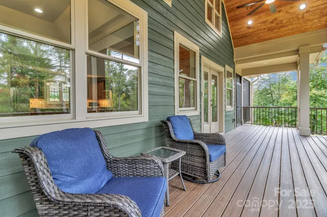 a view of balcony with wooden floor and outdoor seating