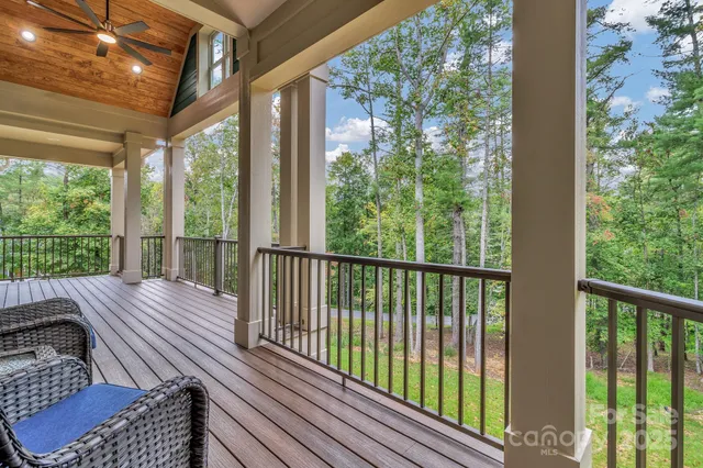 a view of balcony with wooden floor