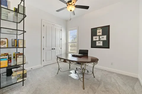 a view of a workspace with furniture