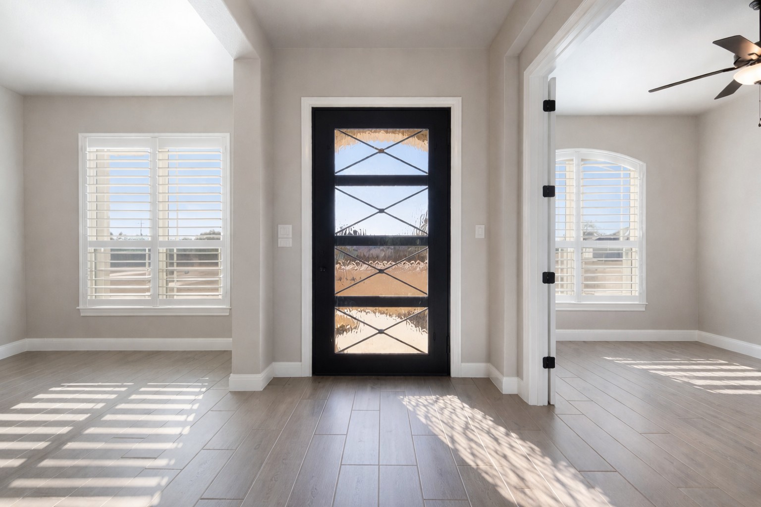 1006 Woodpark Lane Georgetown, TX 78633 - Photo 3 of 27 an empty room with wooden floor and windows