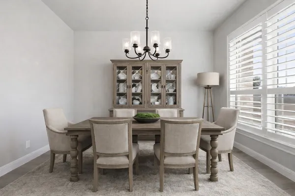 a dining room with furniture and window