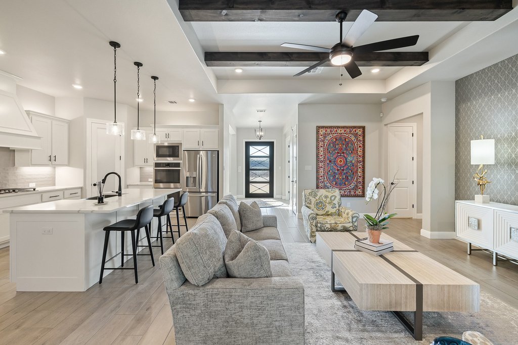 1006 Woodpark Lane Georgetown, TX 78633 - Photo 6 of 27 a living room with furniture kitchen view and a chandelier