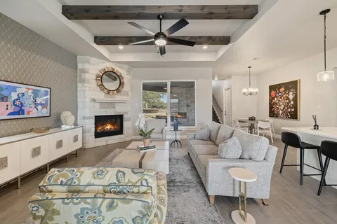 a living room with furniture and a fireplace