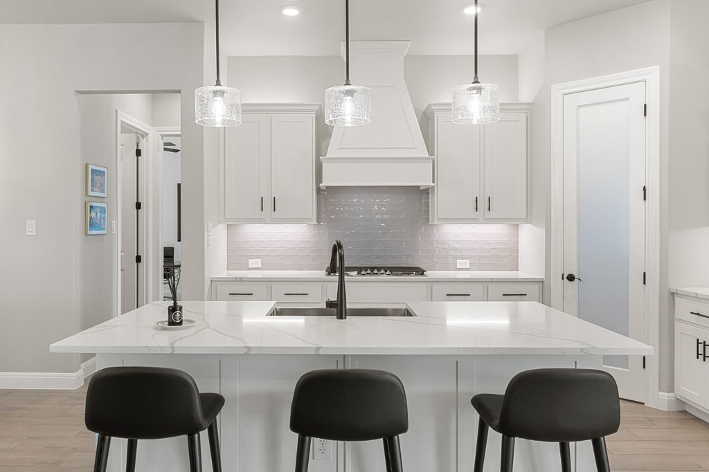 1006 Woodpark Lane Georgetown, TX 78633 - Photo 10 of 27 a kitchen with stainless steel appliances a sink a stove a refrigerator and white cabinets