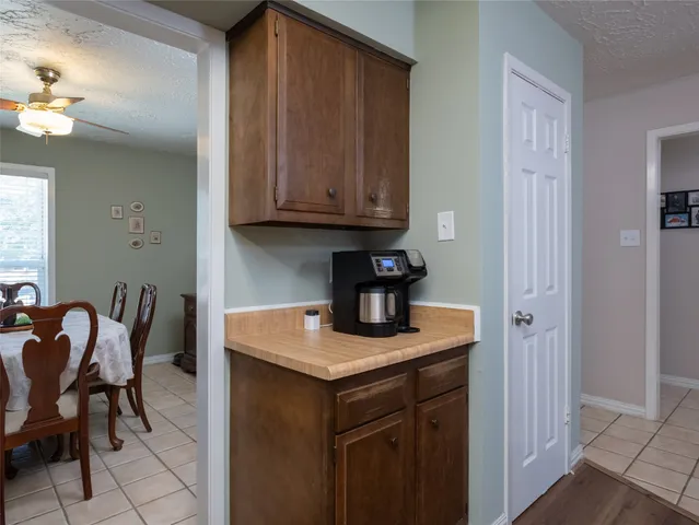 a kitchen with a sink cabinets and wooden floor