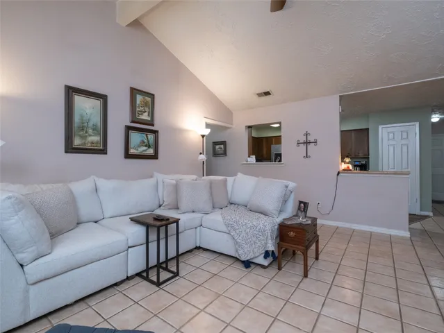 a living room with furniture and a couch
