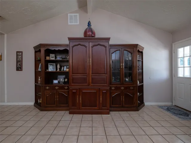 a view of a dresser and storage in a room