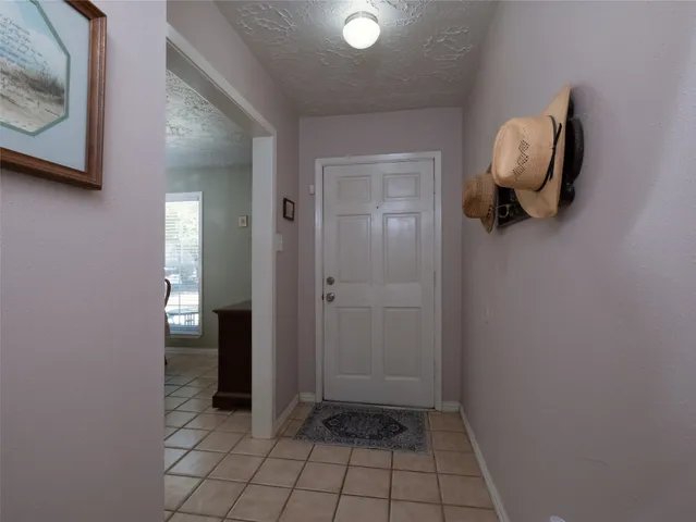 a view of a livingroom and mirror