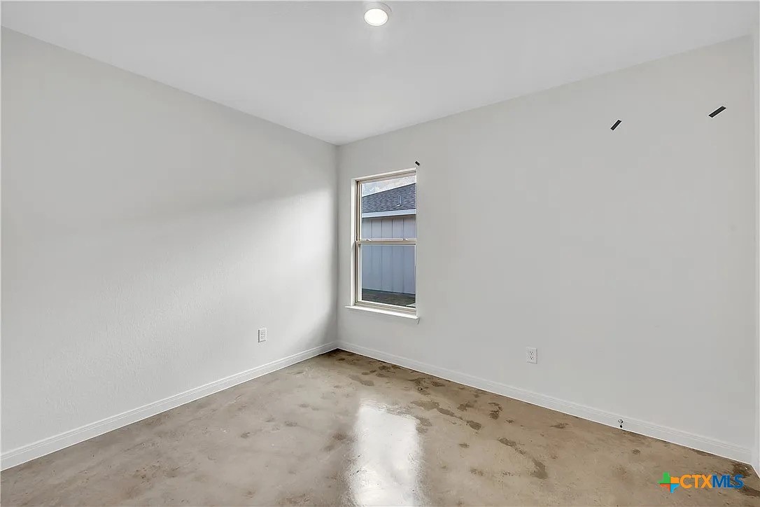 908 Smoke Tree Lane, Unit B Killeen, TX 76543 - Photo 11 of 13 an empty room with a window