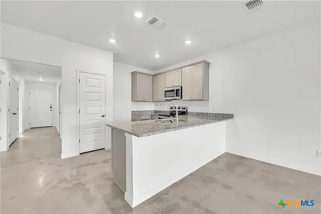 a view of a bathroom with a sink mirror and shower