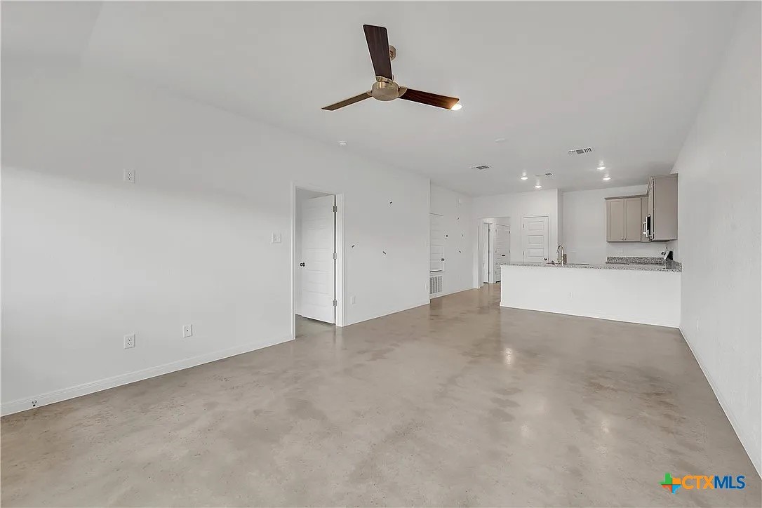908 Smoke Tree Lane, Unit B Killeen, TX 76543 - Photo 5 of 13 a view of a kitchen with a sink and cabinet area