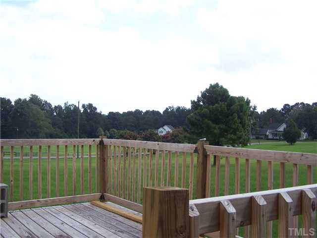 1257 Sanders Road Benson, NC 27504 - Photo 11 of 15 Large deck off the family rooms makes a great spot for grilling Patio/Deck