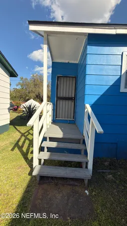 a view of balcony with furniture