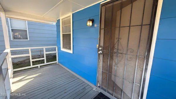 a view of a balcony with door