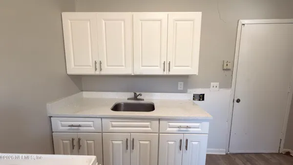 a view of a kitchen with appliances and cabinets