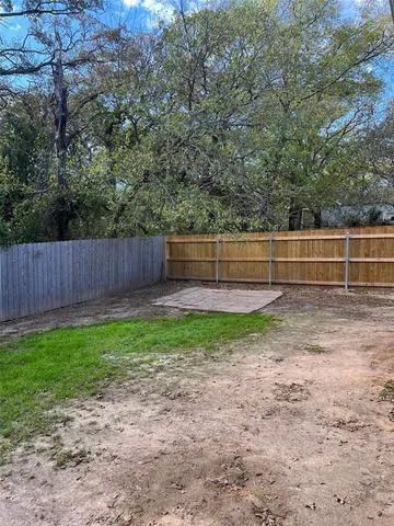 a view of backyard with green space