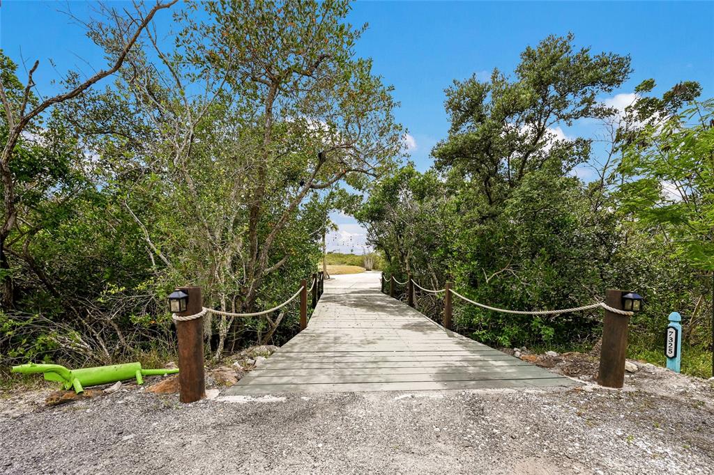 7325 Holly Road Terra Ceia, FL 34250 - Photo 75 of 87 a view of a pathway of a wooden fence