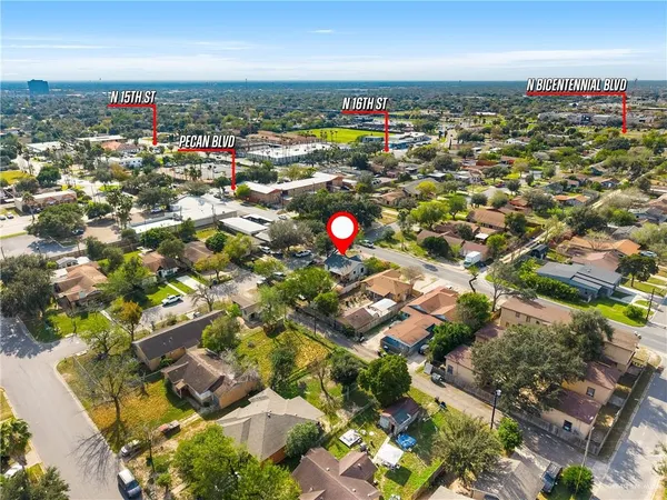 an aerial view of residential houses with outdoor space