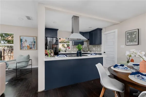 a kitchen with a table and chairs in it