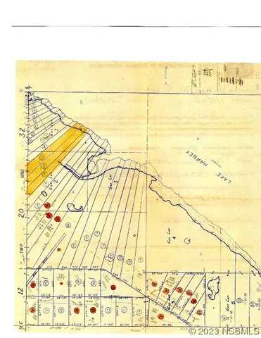 a view of a field with an ocean view