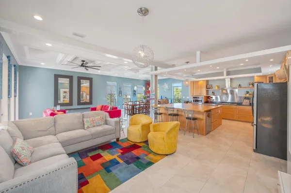 a living room with furniture kitchen and kitchen view