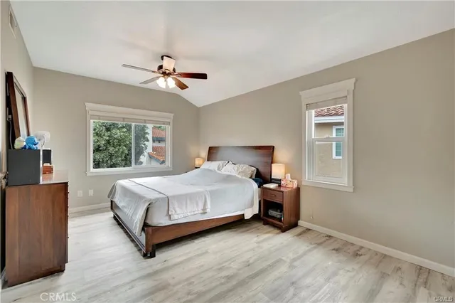 a bedroom with a bed dresser and a window