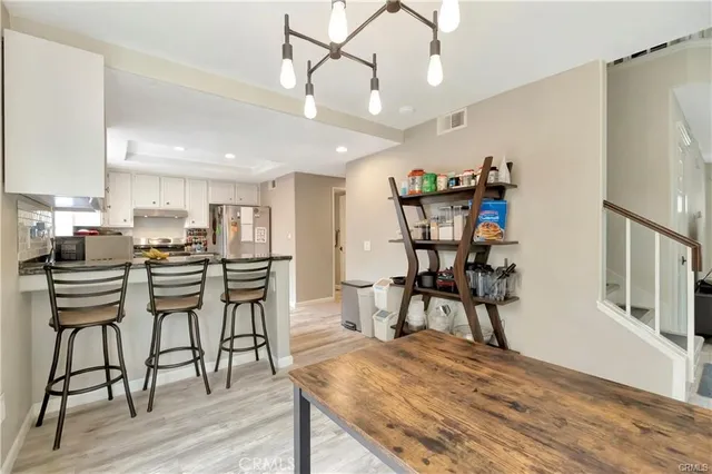 a view of a kitchen and dining room