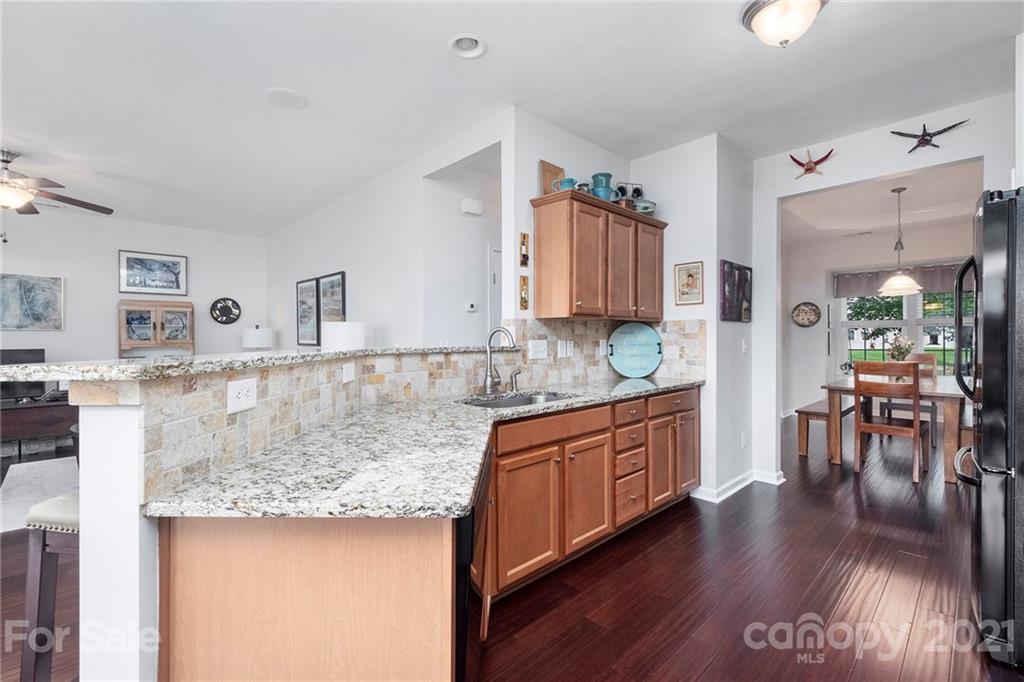 411 Windsor Gate Drive Fort Mill, SC 29708 - Photo 22 of 40 a kitchen with stainless steel appliances granite countertop a stove a sink and a refrigerator
