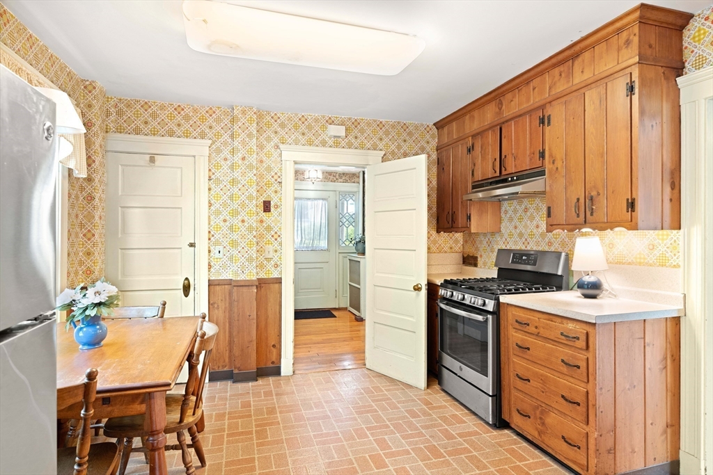 4 Prince Street Marblehead, MA 01945 - Photo 13 of 27 a kitchen with a stove a sink and a refrigerator