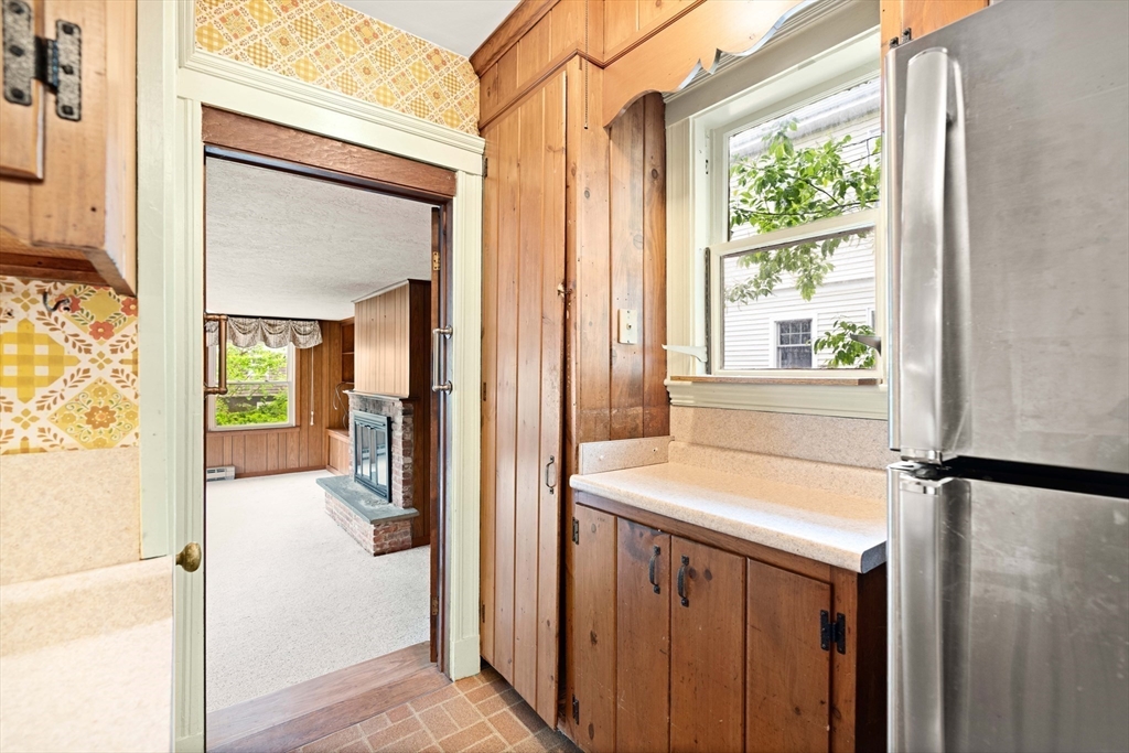 4 Prince Street Marblehead, MA 01945 - Photo 14 of 27 a view of a hallway with a door and wooden floor
