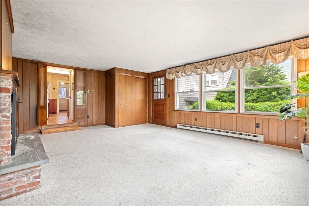 4 Prince Street Marblehead, MA 01945 - Photo 16 of 27 an empty room with large windows and garden view