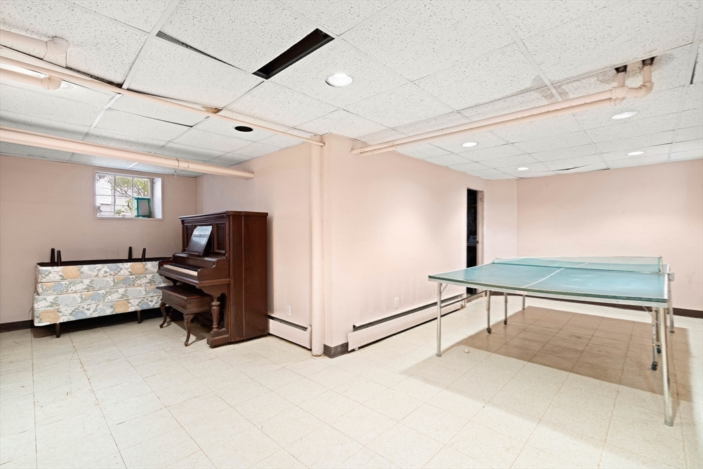 4 Prince Street Marblehead, MA 01945 - Photo 24 of 27 a living room with furniture and a ceiling fan