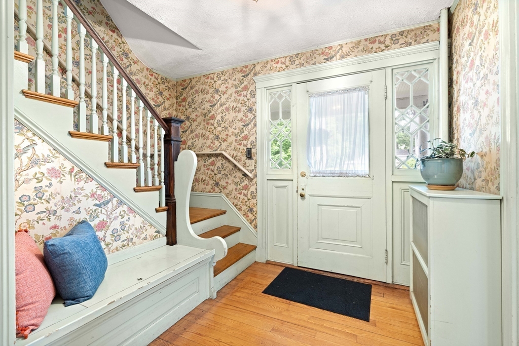 4 Prince Street Marblehead, MA 01945 - Photo 5 of 27 a view of an entryway with wooden floor and stairs
