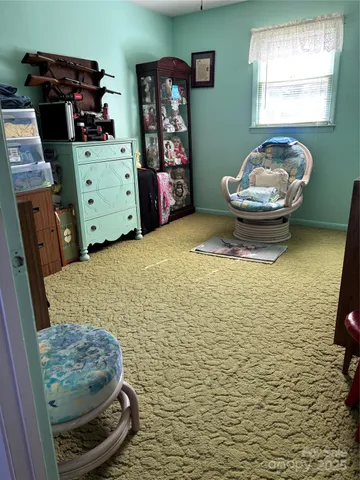 a bathroom with a toilet and a mirror