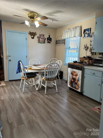 a dining room with furniture and wooden floor