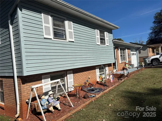a view of a car park in front of a house