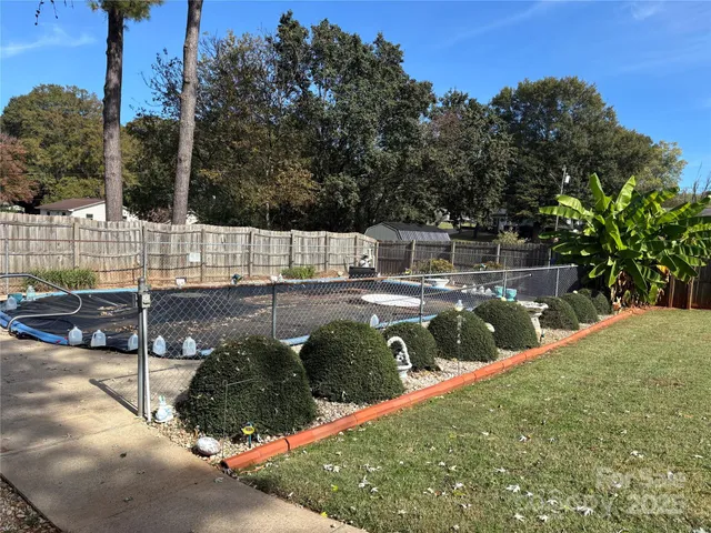 a view of a park with large trees