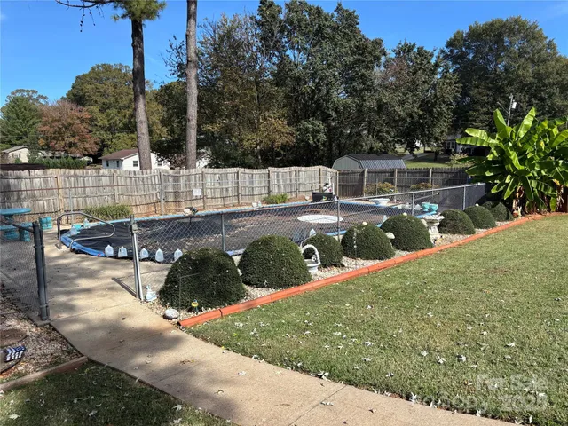 a view of a backyard with sitting area