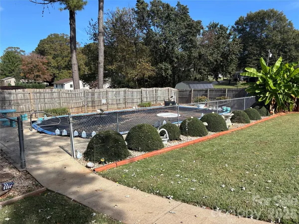 a view of a backyard with sitting area