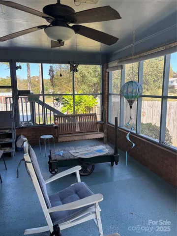a reading room with furniture and a window
