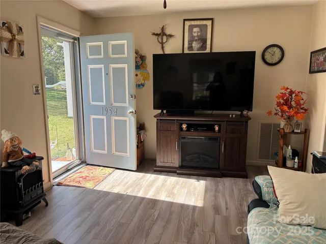 a living room with furniture and a flat screen tv