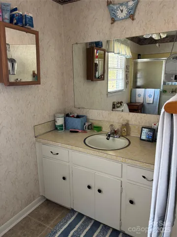 a bathroom with a sink and a mirror