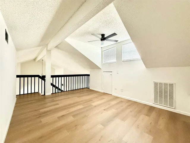 a view of a hallway with a window