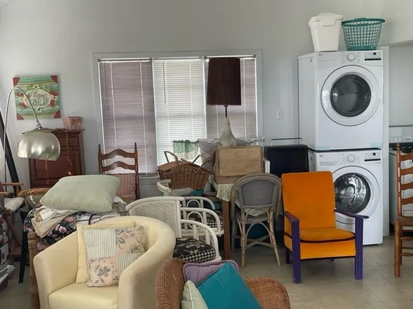 a living room with furniture a rug and a window