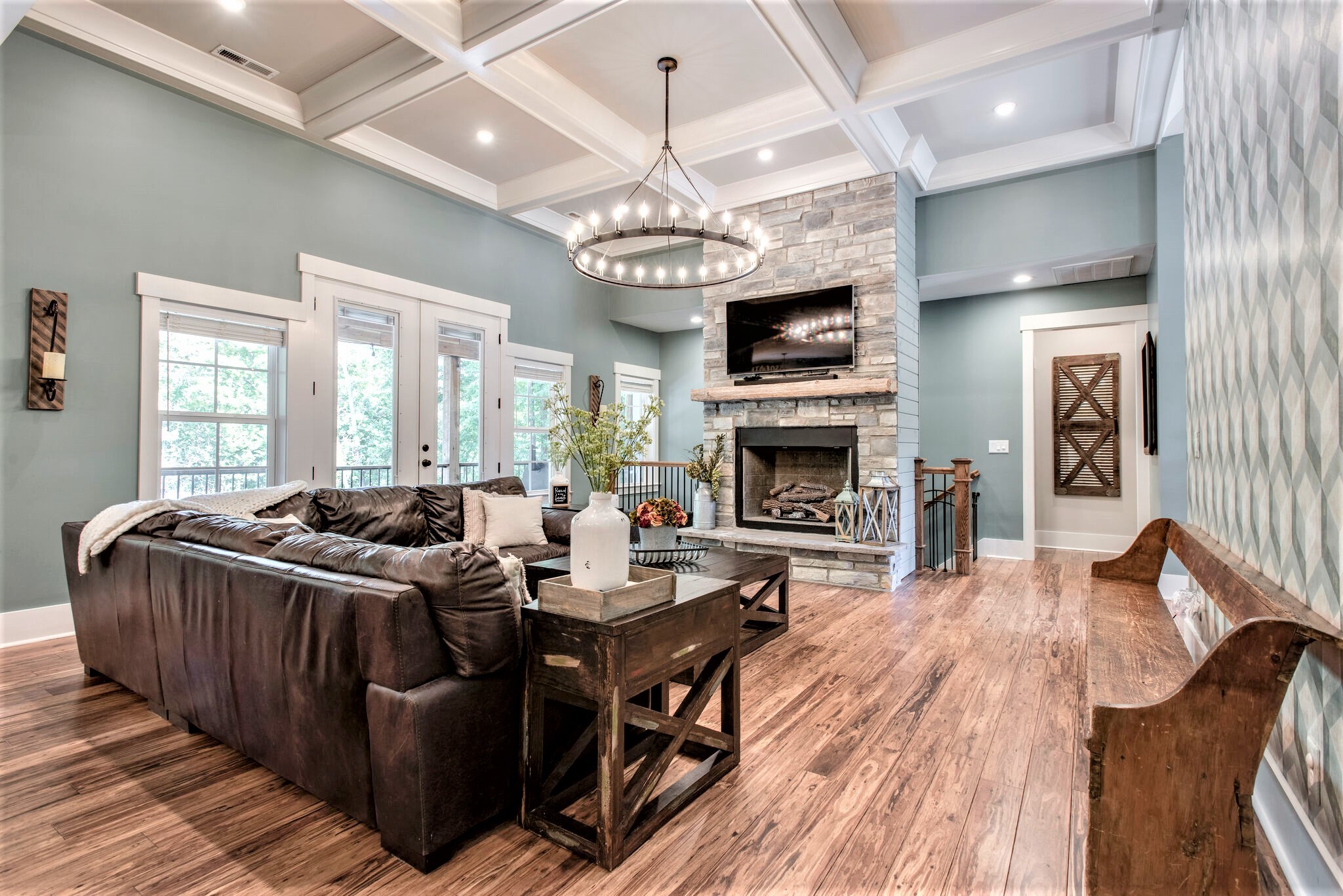 1387 Camp Ravine Road Burns, TN 37029 - Photo 13 of 49 a living room with furniture a fireplace and a chandelier