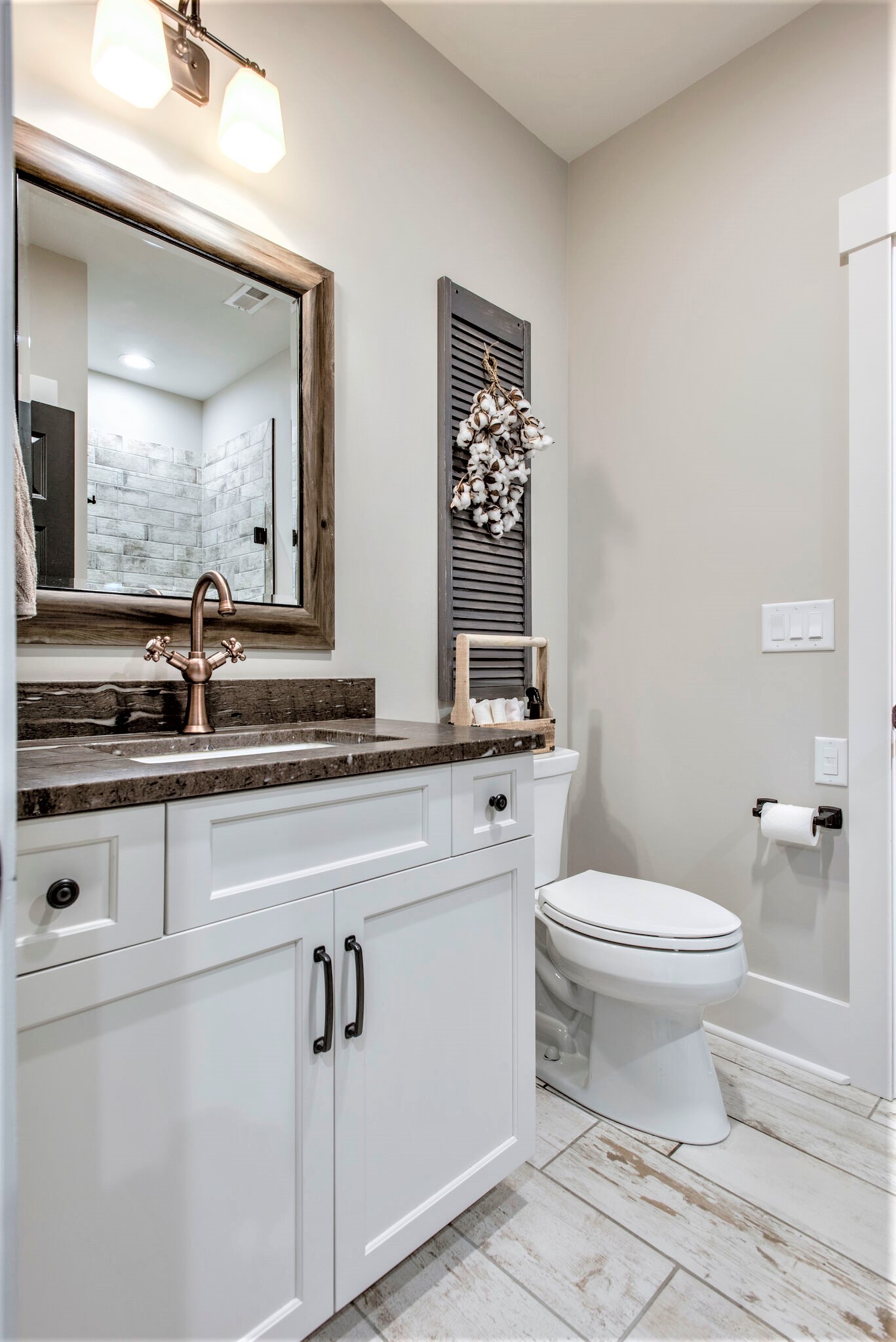 1387 Camp Ravine Road Burns, TN 37029 - Photo 25 of 49 a bathroom with a toilet a sink and mirror