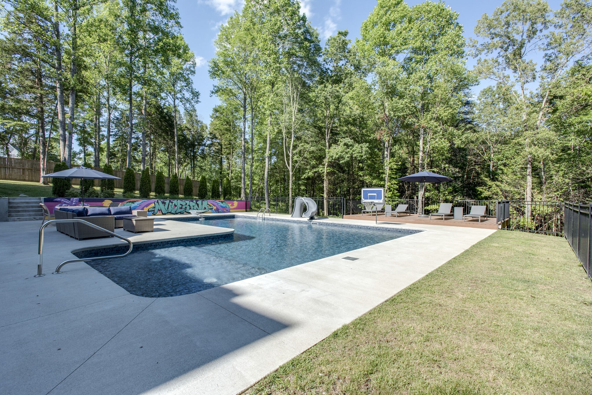 1387 Camp Ravine Road Burns, TN 37029 - Photo 37 of 49 a swimming pool with outdoor seating and trees